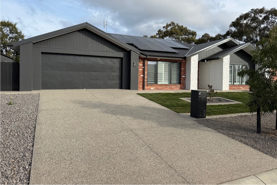 Concreting projects Bendigo - Exposed aggregate driveway sweeping up to a double garage on a new home build, Maiden Gully.