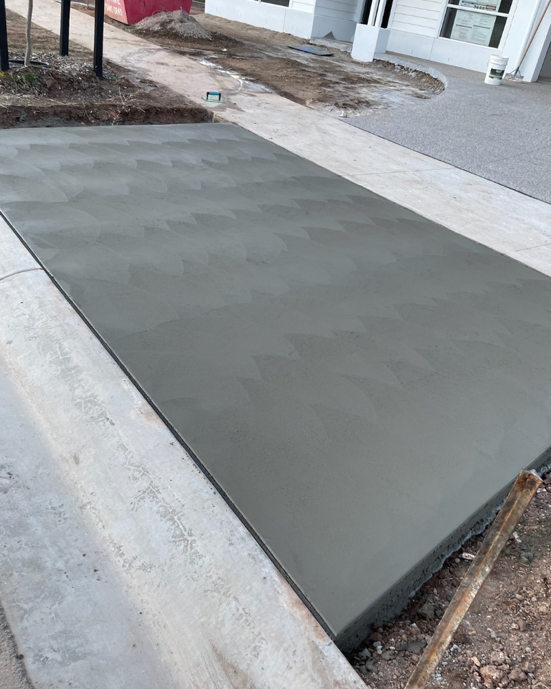 Fan-trowelled driveway crossover connecting the new pour to the street, Bendigo.