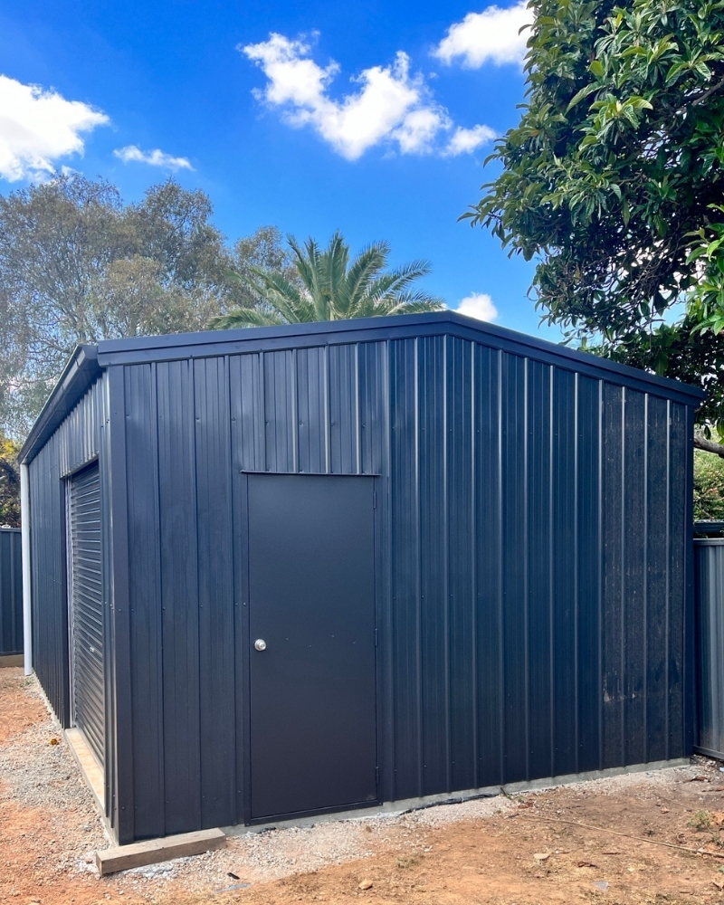 Charcoal kit shed standing on a freshly poured concrete shed slab, Strathdale.